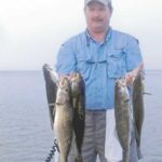 Rob Macelroy used a Super Spook Junior topwater lure to land a nice brace of speckled trout.