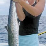Caroline Boyd displays her first king mackerel.