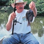 The author with a pound-and-a-half bluegill that had the fight of a 5-pound bass.