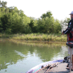 Ryan McMurtury concentrates on the backs of feeder creeks for an early-morning frog bite.