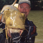 Paul Cleveland of Charlotte puts the squeeze on big catfish like this flathead up and down the Yadkin River system.
