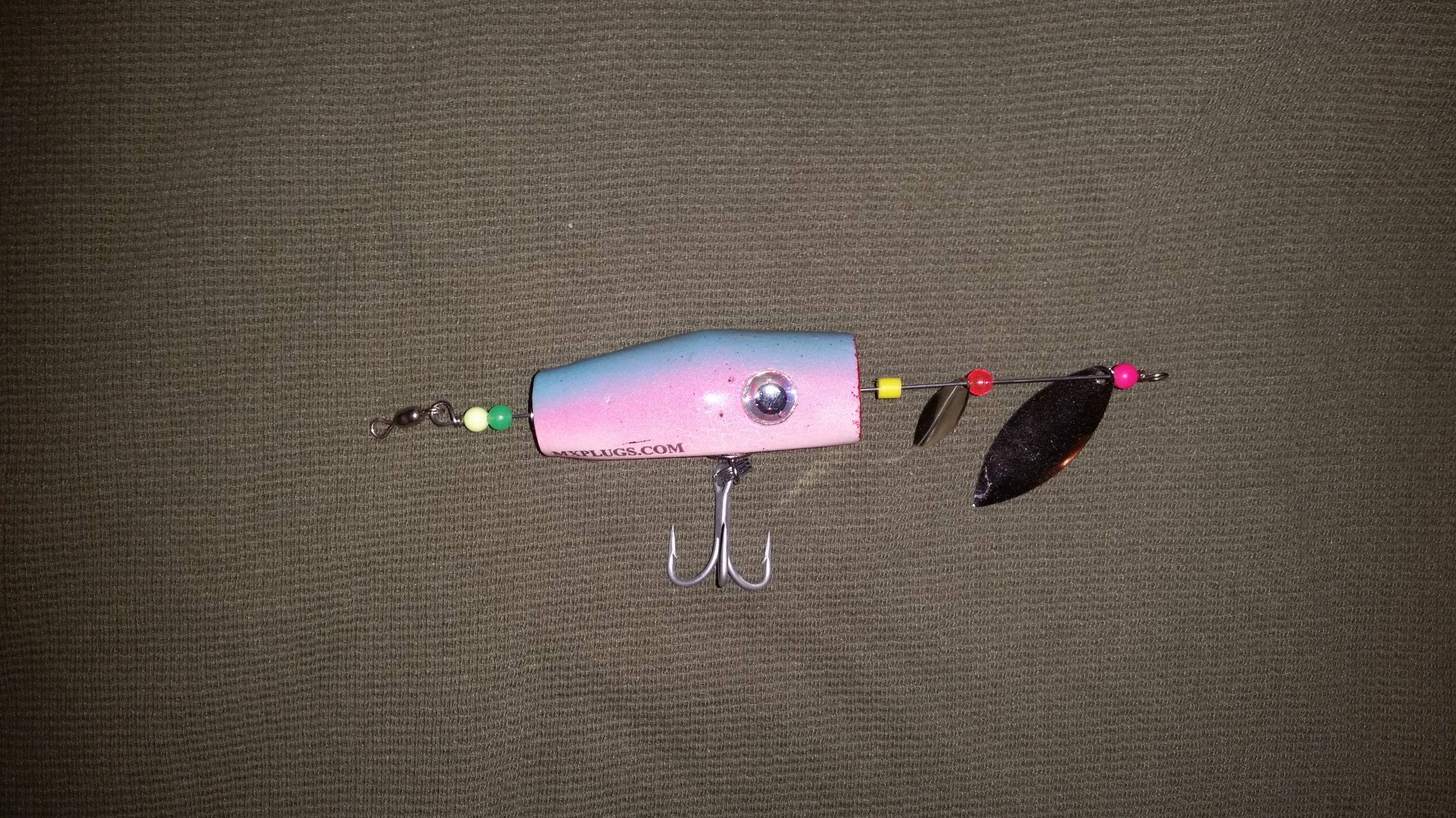 Popping cork has hook on its belly, waiting for a strike