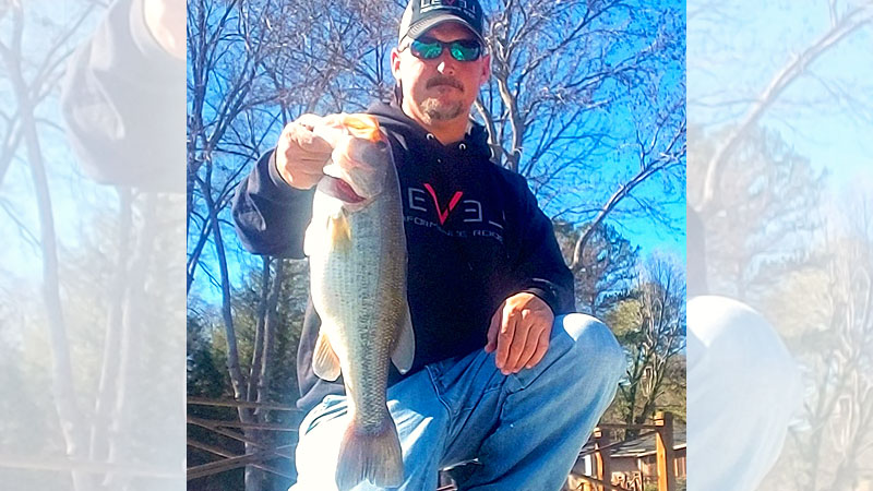 Chris Brown catches plenty of nice High Rock Lake bass in extremely shallow water in April.