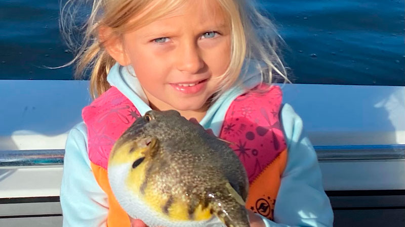 Sloane Downey caught this puffer fish on a family fishing trip on the Neuse River. Max Downey caught the red drum