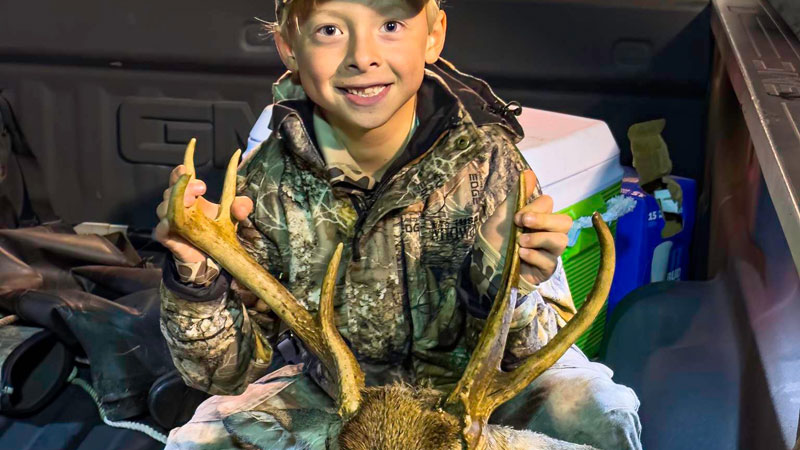Hayes Godwin, 7, with his first buck. Carteret County, NC.