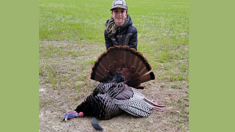 Colton Cates (9 years old) puts the smack down on a huge Granville County Gobbler on open day. Colton shot the turkey with a 20 gauge shotgun at about 6 steps from the blind.