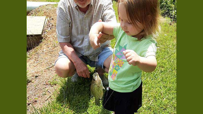 Kimber Oliver, 2-years-old, was fishing with her PawPaw in the pond at home in Rougemont, NC when she caught her first fish.