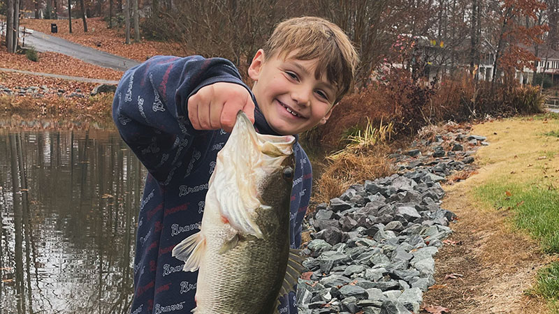 Youth angler Thomas Ebert caught a big bass in his neighborhood farm pond on Nov. 22, 2023.