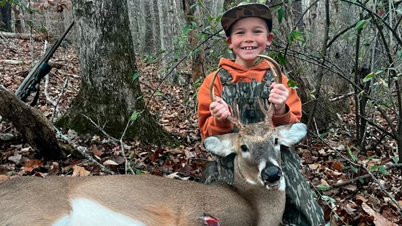 8-year old Easton Roney of Burlington killed his first buck in November with a crossbow while hunting with his dad, Ben Roney.