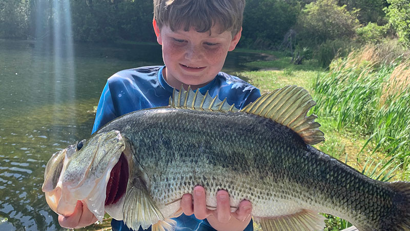 Henry Mclauchlin, 9-years-old, caught a 6.8-pound largemouth bass on April 12, 2024 while fishing his family's property in Rocky Point, NC.