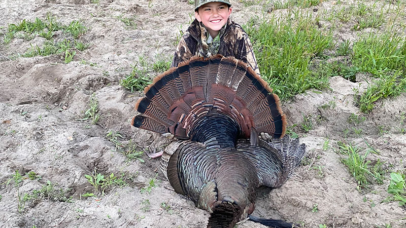 Casen Stanley, a 7-year-old from Clinton NC, harvested this turkey on Youth Saturday near McDaniels, NC.